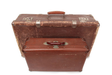 Ancient suitcase for travel on a white background