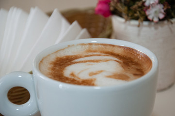 Appetizing coffee with foam in a cup