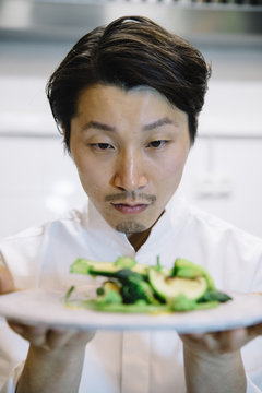 Japanese cook with food plate