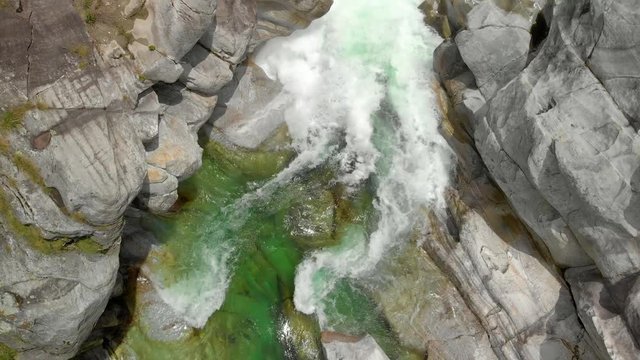 Valle Verzasca - Aerial View of clear and turquoise water stream and rocks in Verzasca River in Ticino - Verzasca Valley in Tessin, Switzerland