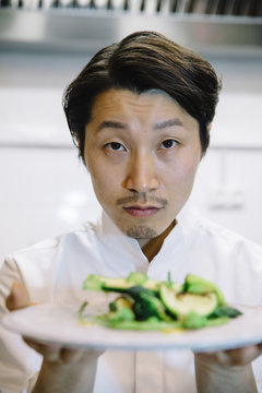 Japanese cook with food plate