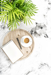 Notebook coffee green tropical plant Office workplace still life