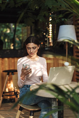 Pretty young girl using mobile phone