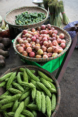 green cucumber and other tropical fruits at asian market