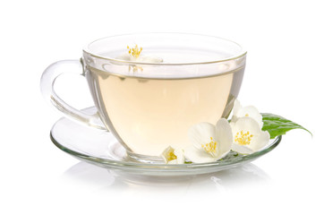 Obraz na płótnie Canvas Glass cup of Tea with jasmine flowers and leaves isolated on white background