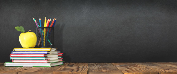 Back to School Concept with Stationery Supplies and Blackboard