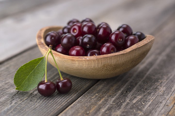 cherries on a wooden table. 