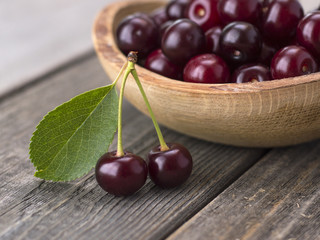 cherries on a wooden table. 