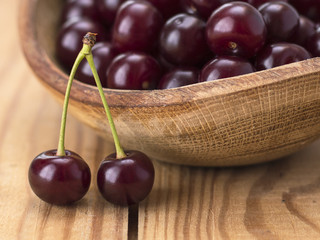 cherries on a wooden table. 
