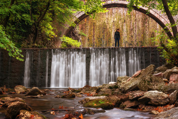 Fototapeta premium Paleokarya, old, stone, arched bridge, between two waterfalls. Trikala prefecture, Thessaly, Greece