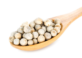 Pepper seed in wood spoon  on white background