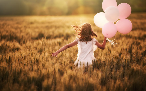 Girl Running On Cereal Field