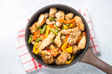Chicken fried with vegetables.