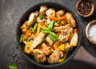 Chicken fried with vegetables.