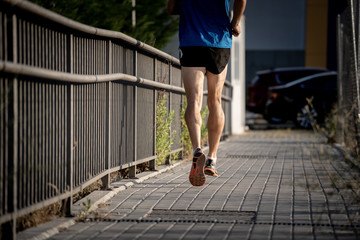 closeup runners legs with urban city background