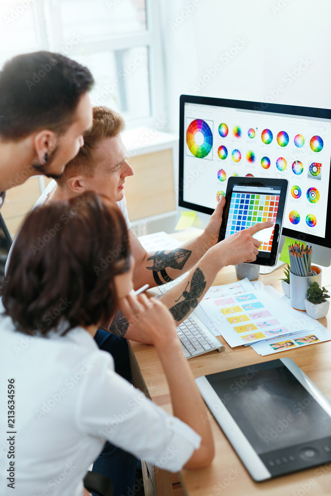 Poster Web Design. Team Of Designers Working On Computer In Office