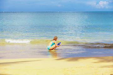 Girl playing on the beach