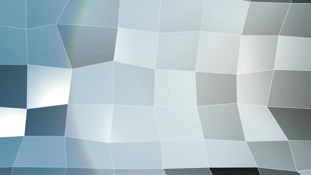 Plan tessellata of blue squares that move under a light source. square polygonal plane that moves like a wave