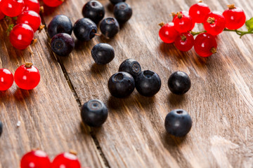 Currants and blueberries on the table. Summer berry.