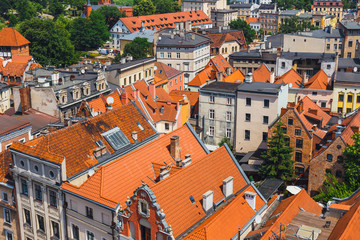 Fototapeta na wymiar Aerial view of historical buildings and roofs in Polish medieval town Torun, Poland