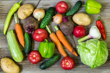 Different colorful vegetables all over the wooden table in full frame. Healthy eating