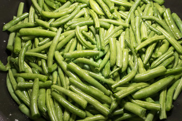 bright green asparagus on a frying pan