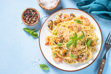 Pasta spaghetti with seafood and cream sauce.