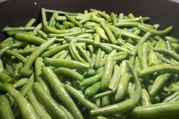 bright green asparagus on a frying pan