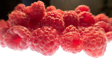 bright colorful raspberry on a white background