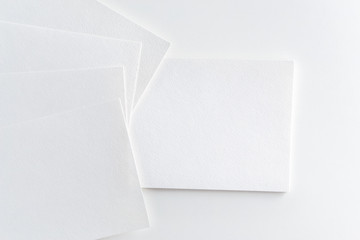 Mockup of business cards stack at white paper background