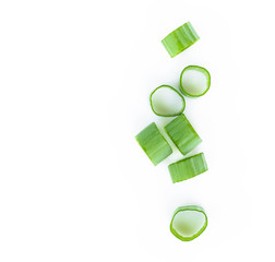 Closeup top view green onion vegetable sliced on white background