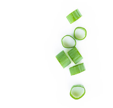 Closeup top view green onion vegetable sliced on white background