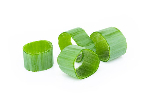 Closeup green onion vegetable sliced on white background