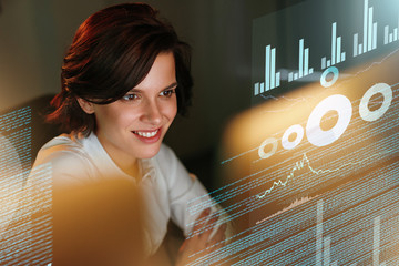Female Programmer Working With Hologram Display