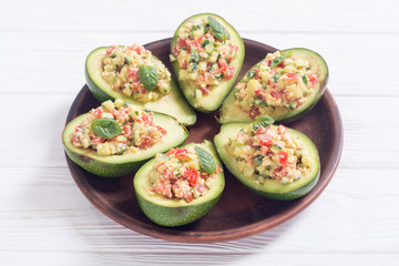 Avocado stuffed with cucumber , tomatoes and eggs