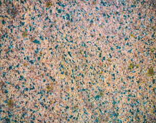 The texture of a stone fence made of granite. Background