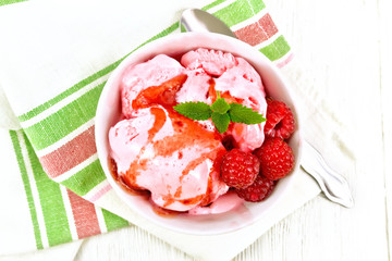 Ice cream crimson with syrup on light board top