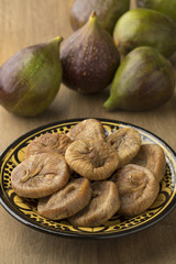 Dish with dried figs and ripe fresh ones