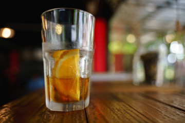 Iced cold brew coffee with slice of orange