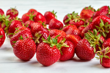 Background of ripe strawberries. Close up fresh juicy berries. Delicious summer fruit.