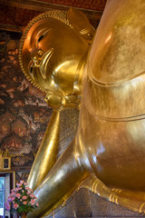 Big golden reclining Buddha of Wat Pho temple in Bangkok