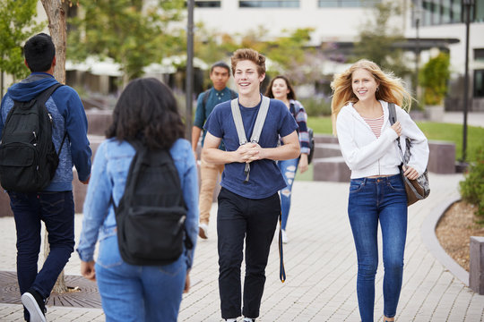 High School Students Socializing Outside College Buildings