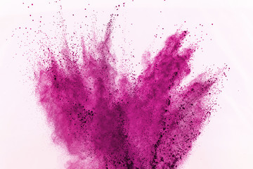 Abstract pink dust explosion on white background. abstract colored powder splatted on white...