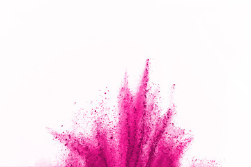 Abstract pink dust explosion on white background. abstract colored powder splatted on white...