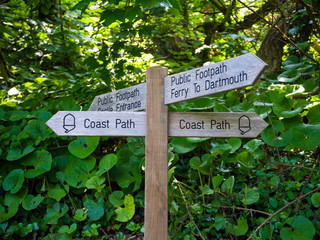 Old wooden public footpath, ferry and Dartmouth Castle sign , Devon, United Kingdom, May 24, 2018