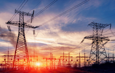 distribution electric substation with power lines and transformers. - Powered by Adobe