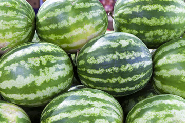 Market counter with delisios watermelons.