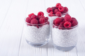 Chia pudding in glass with raspberry