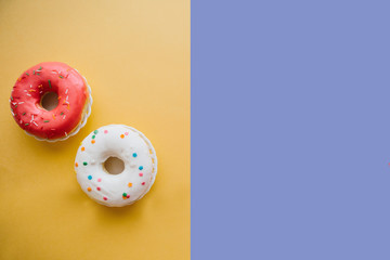 Donuts on a colorful bright background. Nearby place for text