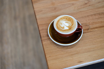 latte art on wooden table